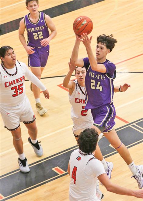 Malakai Curley drives down the lane for two points.