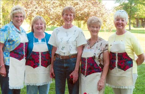 Fran Coover, center, is an out-of-state P.E.O. recipient who met local P.E.O. members while at the Shakespeare in the Park last summer. Local P.E.O. members selling desserts at the event are, from left, Ruth Ann Bunnell, Marlena Burden, Shirley McDonald and Barbara Lyons.