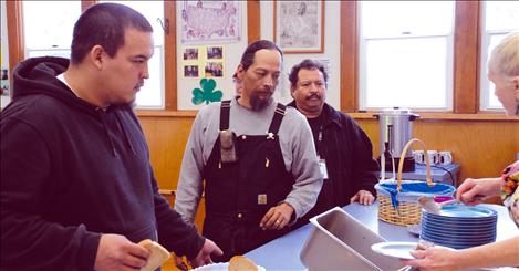 Daniel Brown, Lawrence Mays and Sonny Martinez line up for lunch at the Polson Indian Senior Citizens Center. 