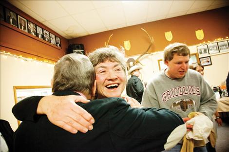 Nancy Teggeman greets John Payne with a big hug at Winterfest.