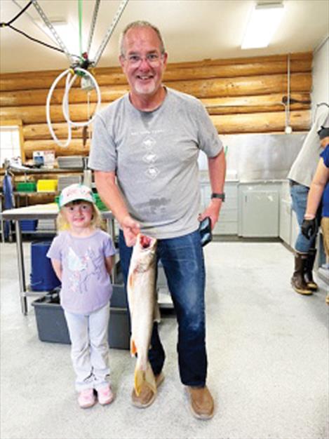Jim Crowe of Polson and granddaughter Emmy Lou turn in lake trout.