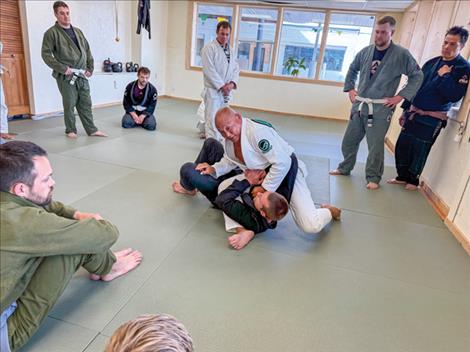 Egan demonstrates on Connor Ferril details of the S-M Mount.