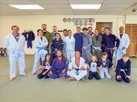 The Rolling Waters Jiu Jitsu team poses for a photo with Egan Inoue.