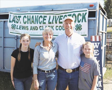 Gov. and First Lady Gianforte with 4-H members Kyla (left) and Emma (right) in East Helena.