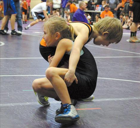 Sierra Cote takes on Kaden Emerald Saturday in the Little Guy Wrestling Tournament hosted in Polson.