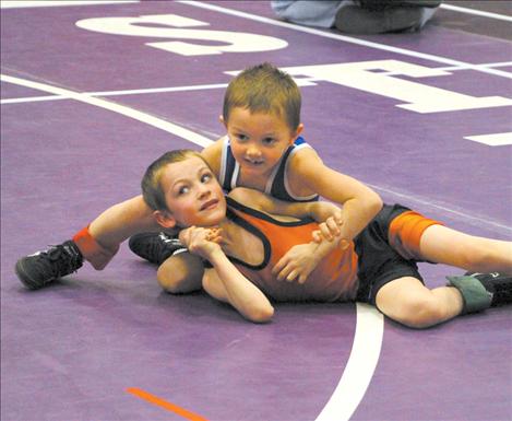 Tommy Sharrard and Chase Brockman wrestle in Saturday’s Little Guy Wrestling Tournament held in Polson.