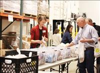 Governor, First Lady Gianforte volunteer at Helena Food Share