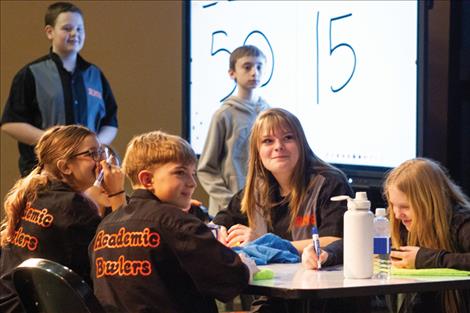 Members of Ronan's Academic Bowl team wait to see if the answer they've given to a question is correct.