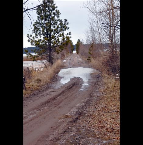 As gullies and barrow ditches fill with water, drivers are urged to use caution as snowmelt can quickly cover the roadway.