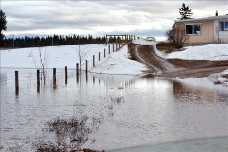 Flooding blocked  the driveway to the Morigeau home Sunday afternoon along Terrace Lake Road in Ronan.