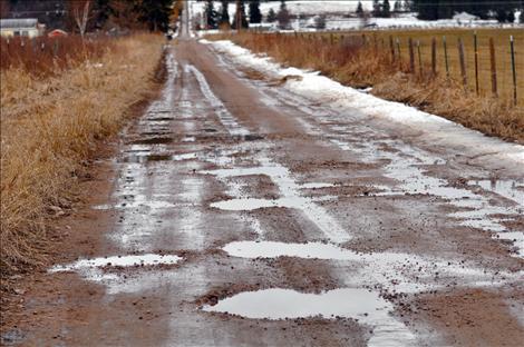 Drivers are urged to use caution around potholes as the spring thaw is expected to continue for months.