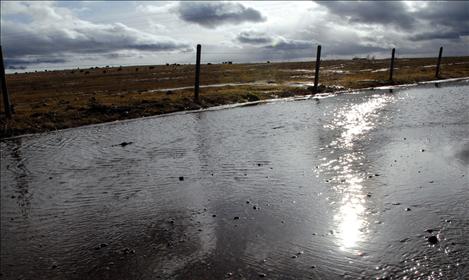 Drivers are urged to use caution on flooded roads as the spring thaw is expected to continue for months.