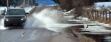 Drivers are urged to use caution on flooded roads as the spring thaw is expected to continue for months.