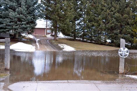 Water levels covered driveways Sunday along Terrace Lake Road in Ronan.