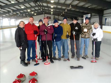 Residents who traveled to Missoula to learn about the sport of curling include, from left, Mindy Burbank, Gayle Siemers, Suz Rittenhouse, Dave Rittenhouse, Dennis Wolfe, Bob Geyer, Roland Burbank, Jan Wolfe and Alan Zubawicz.