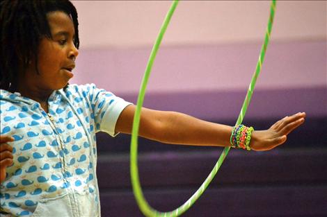 Linderman fourth-grader Zenash Groves spins a bright hula-hoop Friday during Jump Rope For Heart.