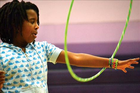 Linderman fourth-grader Zenash Groves spins a bright hula-hoop Friday during Jump Rope For Heart.