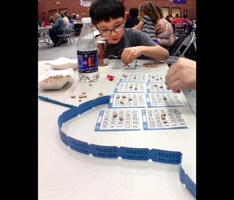 Indy Moll attends the after school program, and tries his hand Friday night trying to win bingo and a few raffle items.