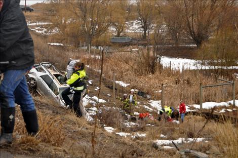 A Polson woman and small infant survived a March 10 wreck when a vehicle southbound  on Highway 93 ran off the roadway, over a guardrail, and flipped into the ravine of an animal walkway just north of Ronan. 