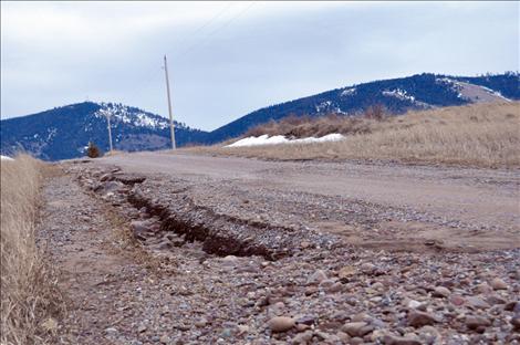 The more navigable parts of washed out Walking Horse Lane are asphalt that was ground into gravel in recent floods. The formerly gravel parts of the road are now sand and mud.  