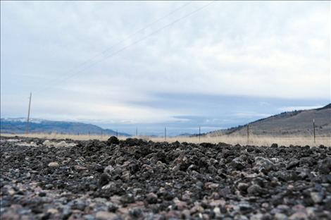 The more navigable parts of washed out Walking Horse Lane are asphalt that was ground into gravel in recent floods. The formerly gravel parts of the road are now sand and mud.  