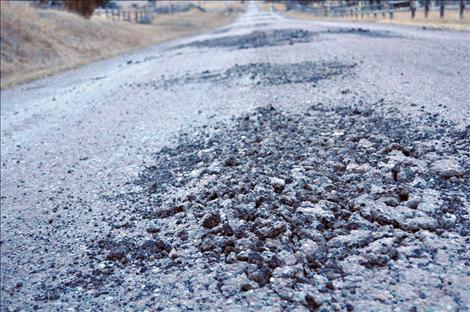 The more navigable parts of washed out Walking Horse Lane are asphalt that was ground into gravel in recent floods. The formerly gravel parts of the road are now sand and mud.  