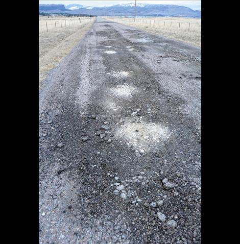 The more navigable parts of washed out Walking Horse Lane are asphalt that was ground into gravel in recent floods. The formerly gravel parts of the road are now sand and mud.  