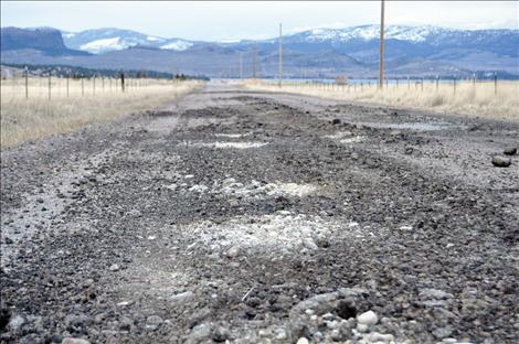 The more navigable parts of washed out Walking Horse Lane are asphalt that was ground into gravel in recent floods. The formerly gravel parts of the road are now sand and mud.  