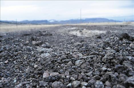 The more navigable parts of washed out Walking Horse Lane are asphalt that was ground into gravel in recent floods. The formerly gravel parts of the road are now sand and mud.  