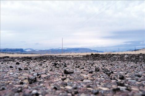 The more navigable parts of washed out Walking Horse Lane are asphalt that was ground into gravel in recent floods. The formerly gravel parts of the road are now sand and mud.  