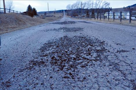 The more navigable parts of washed out Walking Horse Lane are asphalt that was ground into gravel in recent floods. The formerly gravel parts of the road are now sand and mud.  