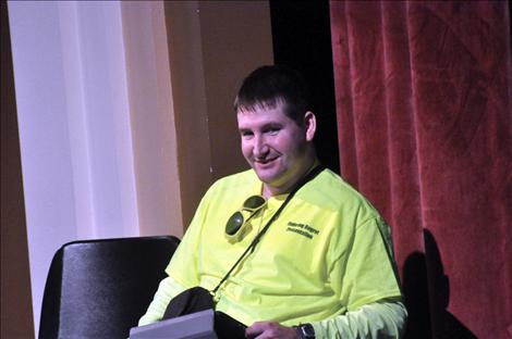 Eric Krug, bound to a wheelchair because of a drunken driving accident, uses an iPad to talk with students in Ronan about consequences.