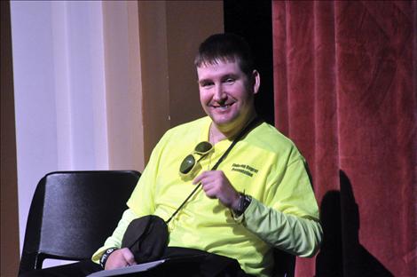 Eric Krug, bound to a wheelchair because of a drunken driving accident, uses an iPad to talk with students in Ronan about consequences.