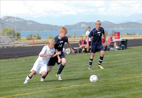 Polson Pirate Alex Helgeson maneuvers around a Loyola player last Thursday. Helgeson scored two goals in the game.