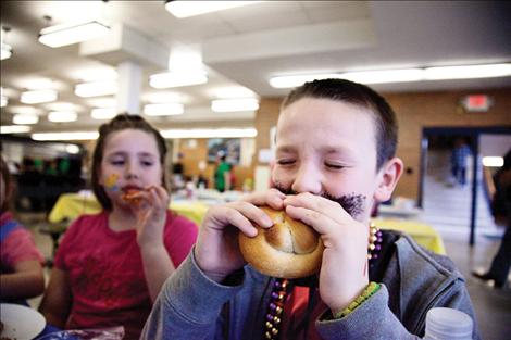 NT Tucker takes a huge bite of locally grown food.