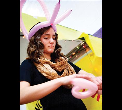 Tessa Nunlist shapes balloons at the Winter Carnival Sunday, March  22 at Polson High School.