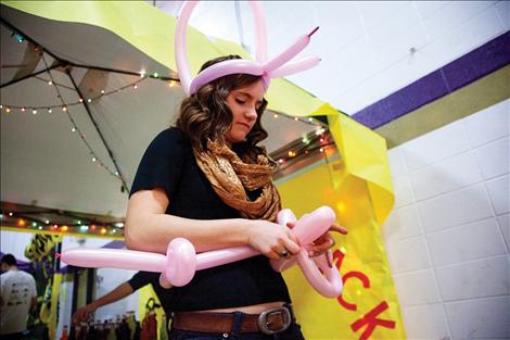 Tessa Nunlist shapes balloons at the Winter Carnival Sunday, March  22 at Polson High School.