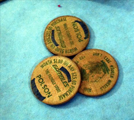 Wooden coins from the 1970s carnival are displayed.