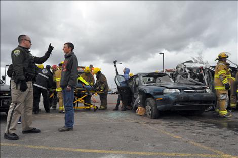 Brian Casey administers field sobriety tests to Ronan student Jesse Melton during the drunken driving reenactment.