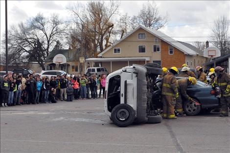 Students watch the drunken driving reenactment at Ronan High School.