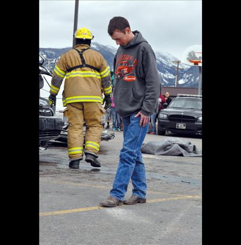 Ronan student Jesse Melton portrays a driver undergoing a field sobriety test during the reenactment.