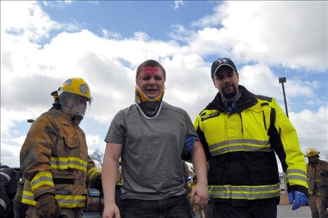 Ronan student Tommy Oschmann portrays a drunken driver during the reenactment.