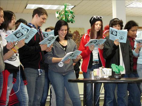 Upward Bound students Rosie Coffman, left, Luiz Gonzalez, Agnes Nomee, Liz Morigeau, Haven Cenicola, and Mars Sandoval sing at St. Luke’s Extended Care facility.