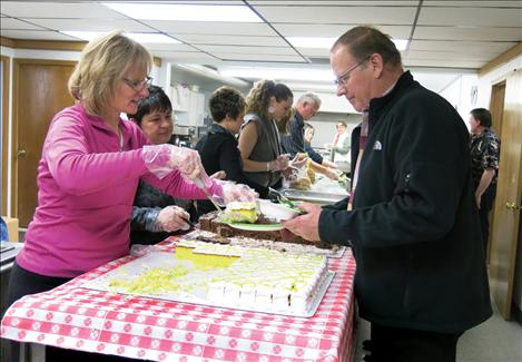 Alan Detert of St. Ignatius is served cake at the 35th annual Ronan Chamber of Commerce Ag Community Appreciation Banquet.