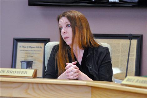 Commissioner Ann Brower listens to concerns about creation of an improvement district for Canal Road. 