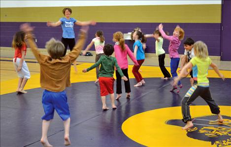 Children warm up before the learning to tumble.