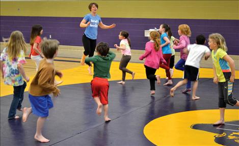 Children warm up before the learning to tumble.