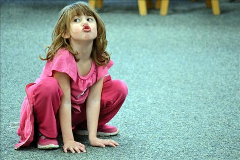 Kendall Hendricks pretends to be a frog in the Oula, Jr., session at the Kids Create event, held Saturday at Polson Middle School.