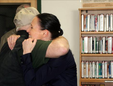 Hugs are in order as Lt. Governor Angela McLean visits former coworkers. 