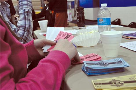 Cierra Dougherty plays banker in a career fair at St. Ignatius High School. 